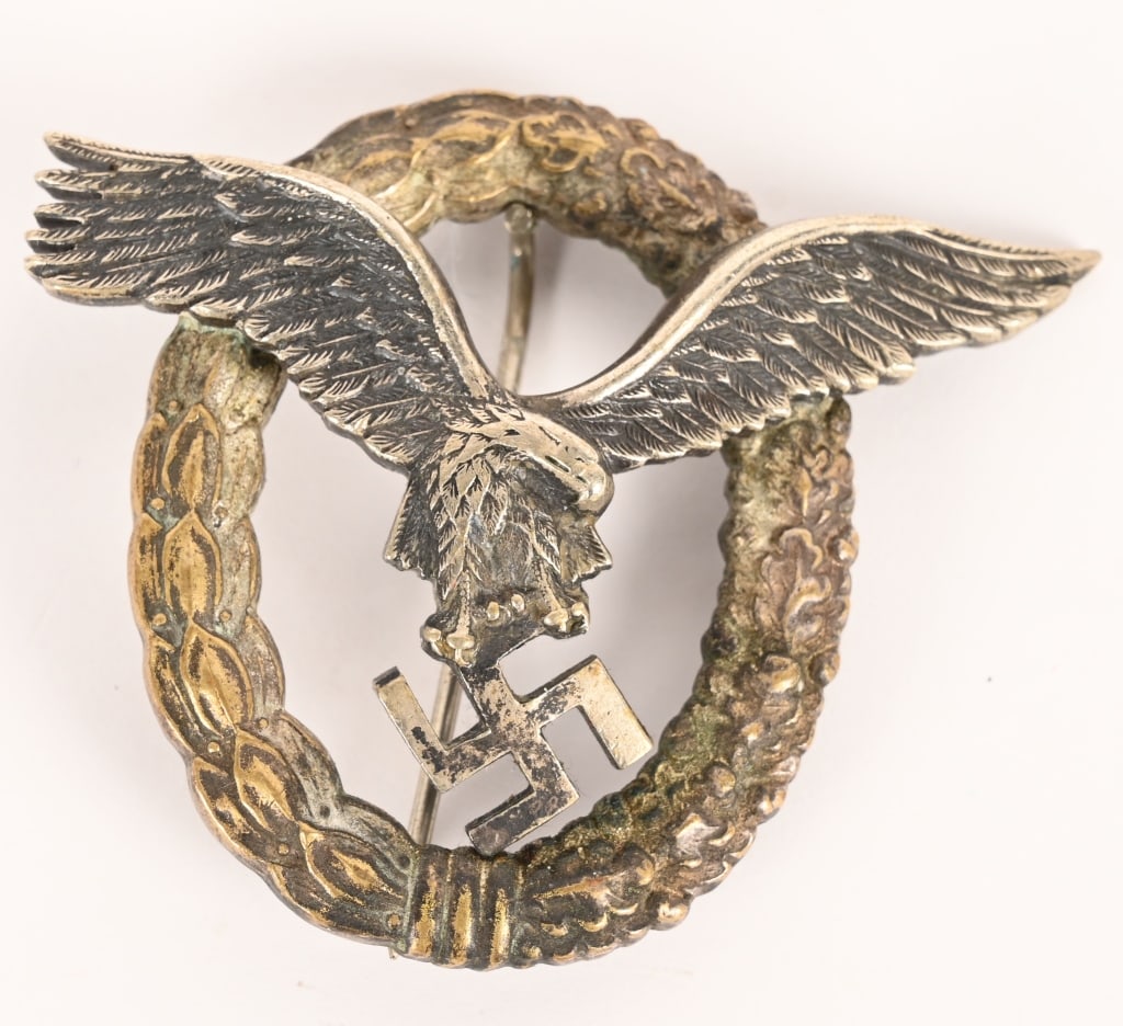 WWII NAZI GERMAN LUFTWAFFE EARLY PILOTS BADGE WW2: Nice quality, early die struck tombac alloy construction, two piece badge is in the form of a vertically oval wreath with a separate burnished silver finished, stylized, spread winged eagle in flight,