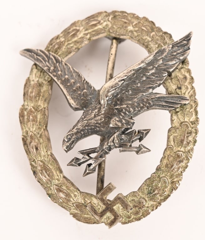 WWII NAZI GERMAN LUFTWAFFE AIR GUNNERS BADGE WW2: Early, nice quality, two piece, die struck alloy construction badge with nickel/silver plating, frosted white wash and burnished silver finishes. The badge is in the form of a nicely convexed, frosted