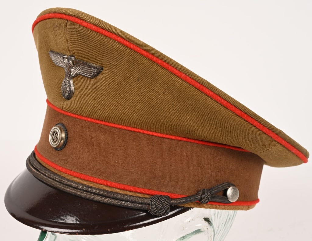 WWII NAZI GERMAN NSDAP GAU AMTSLEITER VISOR HAT: A very fine example of the visor cap worn by a political leader, or Gauleiter, in the early days after the Nazi assumption of power. The cap is constructed of a golden brown whipcord wool material for