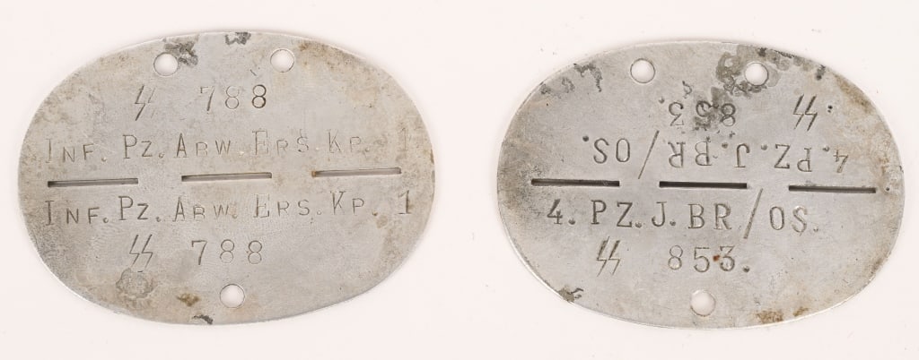 WWII NAZI GERMAN WAFFEN SS DOG TAG LOT OF 2 WW2: Lot of two, WWII Waffen SS Dog Tags to include 1) Aluminum Tag that reads 4.PZ.J.BR/OS SS 853. A Panzer Jager Unit. 2) Aluminum tag that reads SS 788 Inf. Pz. Abw. Ers. Kp. 1 An armored Infantry Anti
