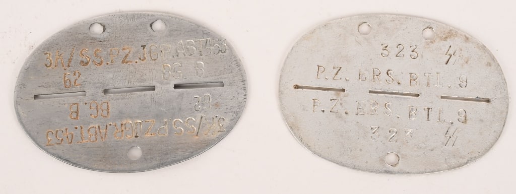 WWII NAZI GERMAN WAFFEN SS DOG TAG LOT OF 2 WW2: Lot of two, WWII Waffen SS Dog Tags to include 1) Aluminum Tag that reads 3.K/SS. PZ. JGR.ABT.453 62 BG. B. A Panzer Infantry Unit and he is Blood Group B 2) Aluminum tag that reads 323. SS P.Z. ERS.