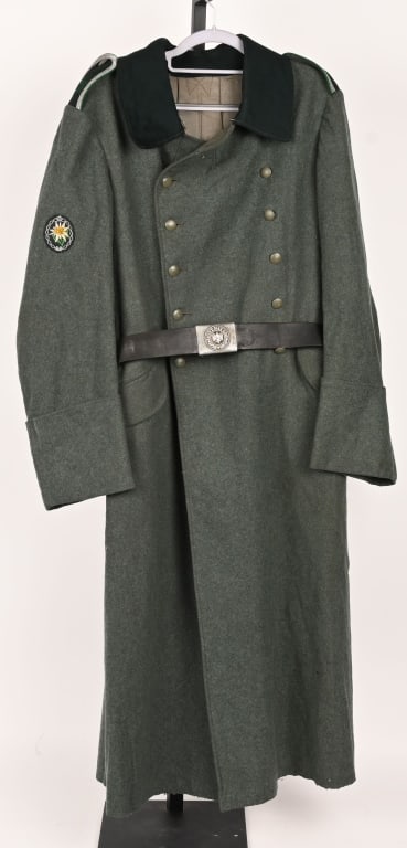 WWII NAZI GERMAN NCO GEBIRGSJÄGER M35 GREATCOAT: Issued, M35 pattern, greatcoat. Field-gray wool construction, double breasted style, full length, greatcoat with a dark green cloth lay down collar. The greatcoat features dual, vertical, parallel, ro