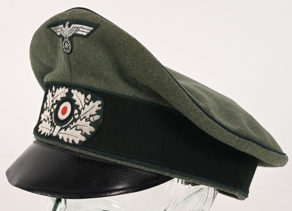 WWII NAZI GERMAN GEBIRGSJÄGER CRUSHER VISOR HAT: Private purchase, "Crusher" style visor cap with a field-gray doeskin wool construction body and crown and a blue/green badge cloth centerband. The cap features wide, green wool waffenfarbe piping to