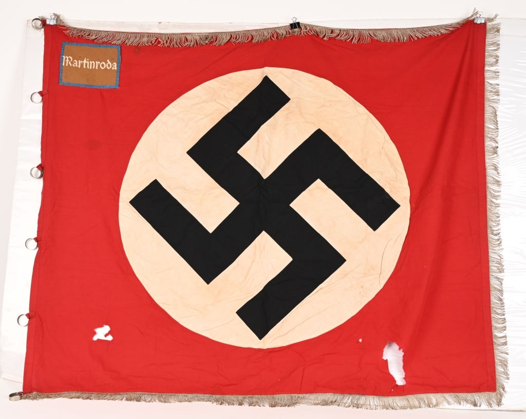 WWII NAZI GERMAN NSDAP ORTS FLAG MARTINRODA WW2: WWII Nazi German flag is for the town of Martinroda which is a municipality in the district Ilm-Kreis, in Thuringia, Germany. This Orts level flag measures 46 inches X 54 inches showing two large hole