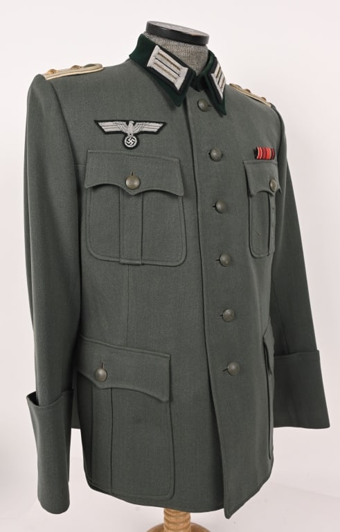 WWII NAZI GERMAN CAPTAINS OFFICER M36 TUNIC WW2: Nice quality, field-gray wool construction tunic with a subtle whipcord weave. The tunic features a five button front closure with dual metal hooks and eyes at the neck. The edge of the left front clo