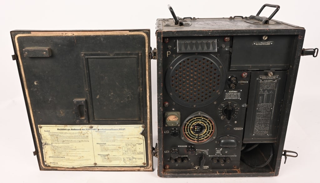 WW2 NAZI GERMAN WR1/P RUDI GERMAN FRONT LINE RADIO: A desirable display piece, a German WR1/P "Rudi" front line radio. The radio, enclosed within a 14 1/2" x 18" x 10" wood case, was widely used by the Wehrmacht during World War II as a source of enter