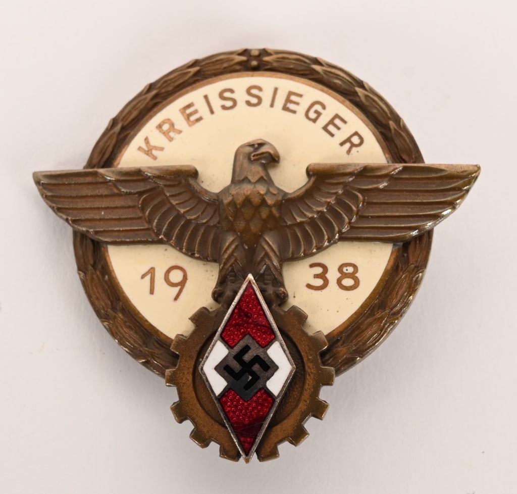 WWII NAZI GERMAN HJ KREISSIEGER 1938 BADGE WW2: Nice quality, multi-piece, bronze washed, die struck tombac construction Kreis level badge with multi-colored enamel work. Badge is in the form of a 1 1/2" diameter, circular base with recessed outer