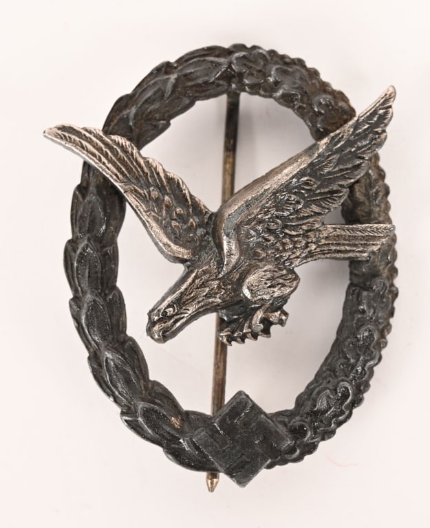 WWII NAZI GERMAN LUFTEWAFFE AIR GUNNER'S BADGE WW2: Two piece, die struck zinc construction badge with silver and dark burnished silver finishes. The badge is in the form of a silver washed, nicely convexed, vertically oval, wreath with laurel leaves t