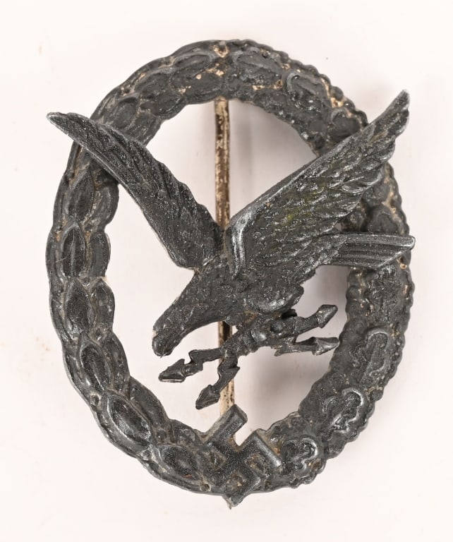 WW2 NAZI GERMAN LUFTWASFFE WIRELESS OPERATOR BADGE: Later zinc construction badge with silver wash. The badge is in the form of a nicely convexed, vertically oval wreath with laurel leaves to the left side and oak-leaves to the right side with a swasti