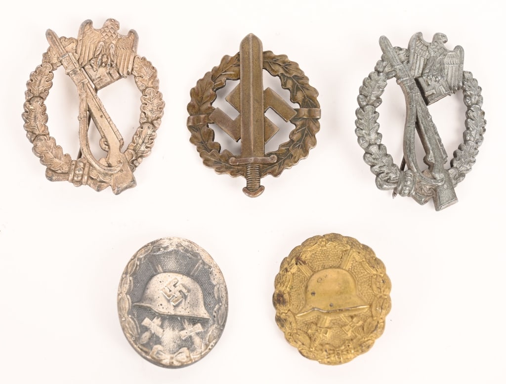 WWII NAZI LOT INFANTRY ASSAULT & WOUND BADGE LOT: Lot of five, WWII Nazi German Badges to include 1) INFANTRY ASSAULT BADGE IN SILVER. Die struck zinc award with silver wash. The nicely detailed badge features an embossed, vertically oval, oak-leaf w