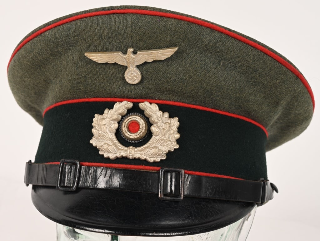 WWII NAZI GERMAN ARMY ARTIILLERY NCO VISOR HAT WW2: Nice quality issued visor cap with a field-gray wool body and crown and a blue/green badge cloth centerband with bright red wool waffenfarbe piping to the crown edge and both the top and bottom edges