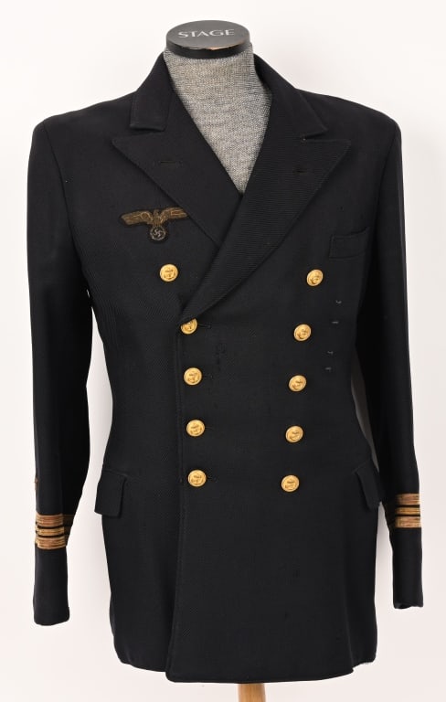 WWII NAZI GERMAN KORVETTENKAPITÄN'S REEFER JACKET: Nice quality, navy blue wool, double breasted jacket with fine whipcord weave. Opened neck jacket features fold back up-swept peak lapels and two parallel rows of five fire gilted, fouled anchor butto