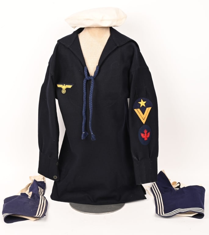 WWII NAZI GERMAN KRIEGSMARINE BLUE JUMPER SHIRT: Blue wool Kriegsmarine jumper shirt. Eagle with golden threads is a machine stitched to the upper right chest. Buttons to the cuffs are all original. The sleeve sports a Gunner-Observer of Automatic A