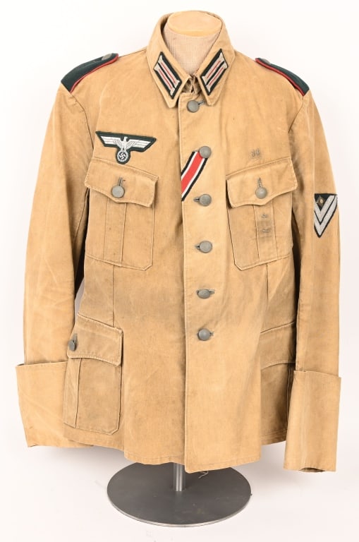 WWII NAZI GERMAN WEHRMACHT TROPICAL TUNIC WW2: Wehrmacht Artillery Tropical Tunic Pleated pockets and a continental collar tabs and shoulder straps and eagle. Light weight, ribbed, khaki/olive, cotton twill construction field blouse features a ver