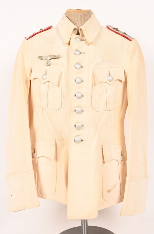 WWII NAZI GERMAN HAUPTMANN WHITE SUMMER TUNIC: White cotton twill tunic with eight (s-ring removable) button front closure with dual hooks and eyes at neck. Lay down collar without collar tabs as prescribed by regulations. Has a nice set of Artill