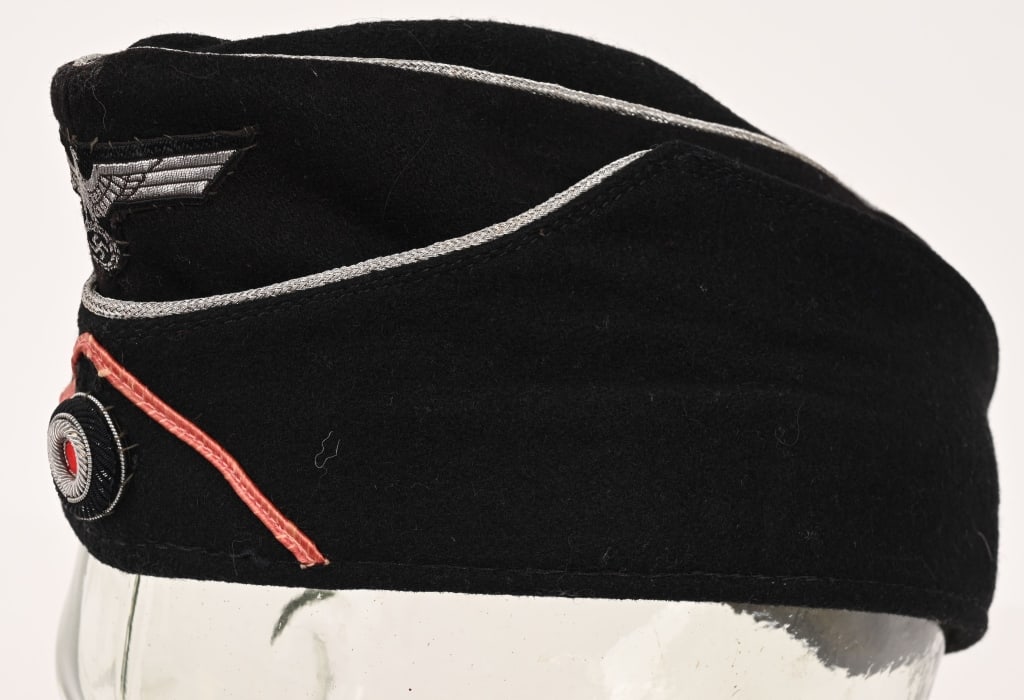WWII NAZI GERMAN PANZER M38 OFFICERS OVERSEAS CAP: Nice quality, M38 pattern, black wool and rayon blend construction cap with a subtly ribbed gaberdine weave. The cap features fold down side and back panels with scalloped slopes to the forward side p