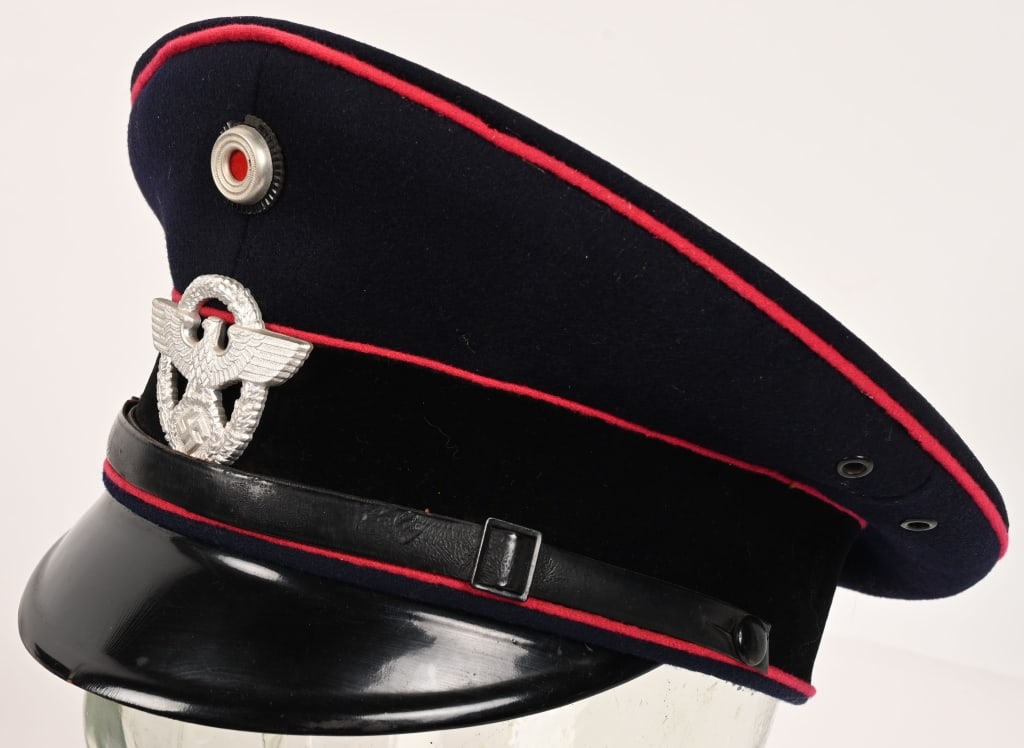 WWII NAZI GERMAN FEUERSCHUTZPOLIZEI NCO VISOR CAP: Nice quality, Feuerschutzpolizei NCO’s visor cap features a deep navy blue doeskin wool body, a black velvet centerband and Feuerschutzpolizei carmine wool truppenfarbe, (Branch of service color