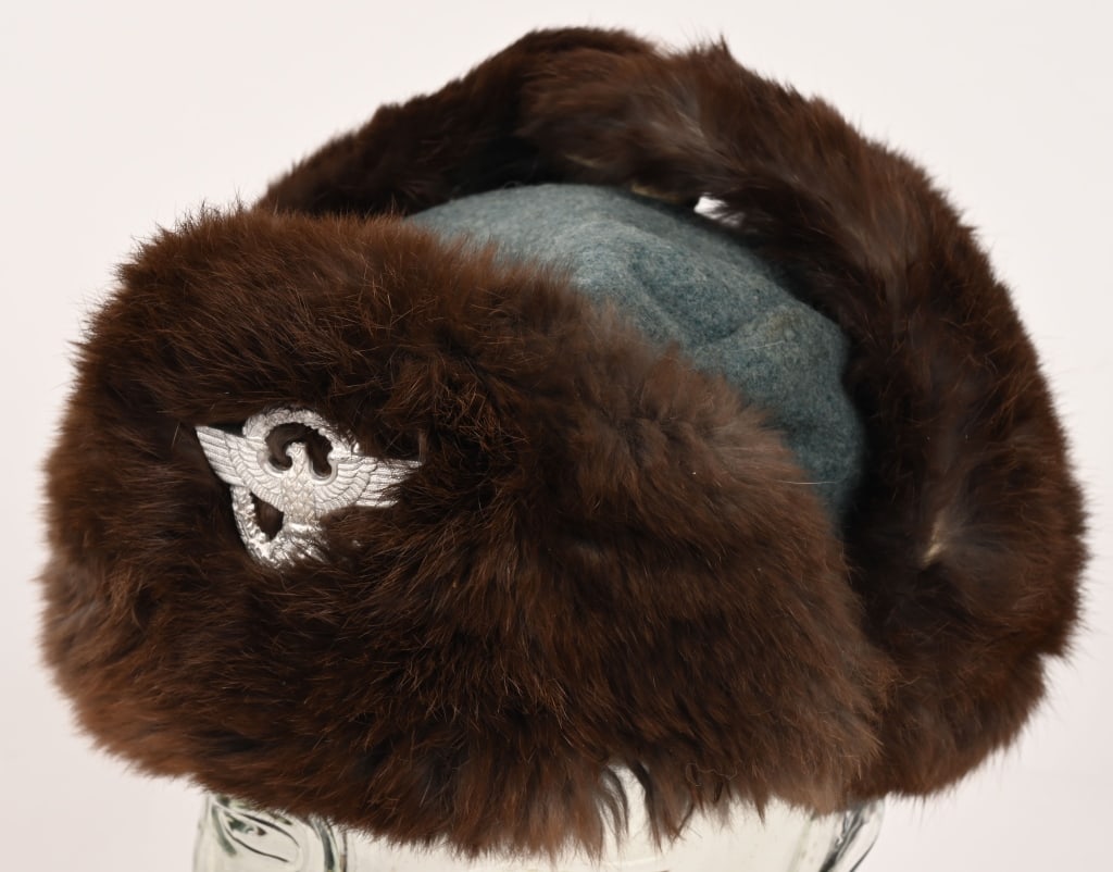 WWII NAZI GERMAN WINTER POLICE FIELD CAP MINT WW2: Field-gray Police green wool construction cap with rabbit fur front, fold down side ear lugs and back panels. Tie-string complete. Quilted rayon liner. Maker marked and size marked 56. Police metal ea