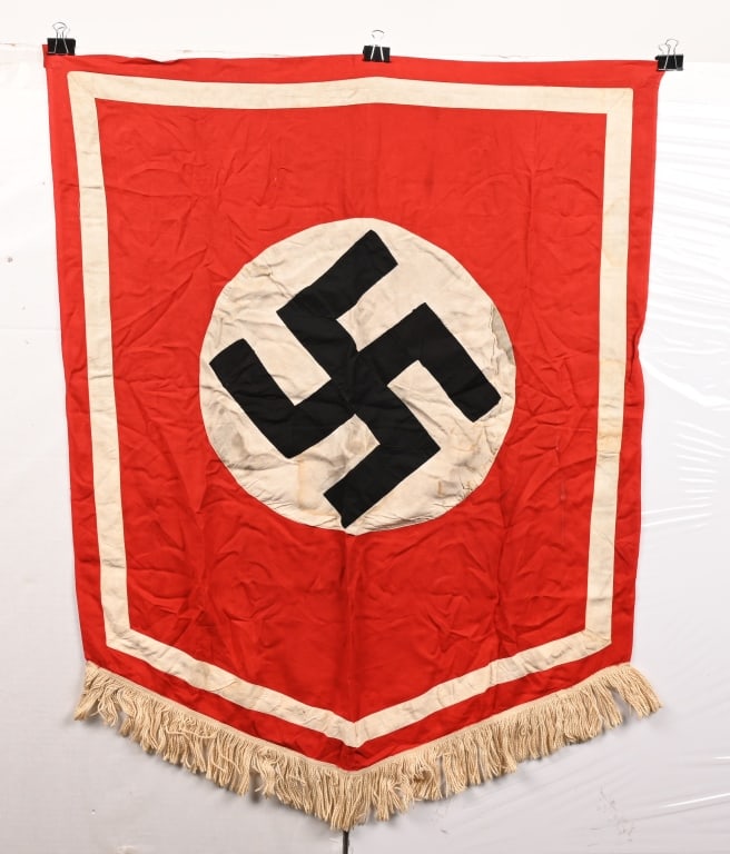 WWII NAZI GERMAN PODIUM BANNER SHIELD SHAPED WW2: Single sided cotton podium banner with a separately applied swastika on the applied disc. Machine stitched white trim. 30" x 36". Excellent.