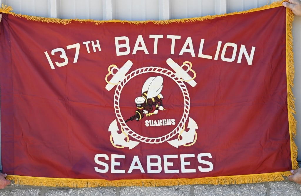 WWII US NAVY 137th SEABEES BATTALION FLAG: 3' x 5' single sided battalion guide on flag with gold tassels. Small silk tag on the spine reads "Geo. P. Johnson Co. Detroit, MICH" and has the insignia for the 137th Naval Construction Battalion or