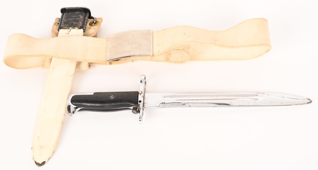 M1 RIFLE NAVY DRESS BAYONET WITH FROG & BELT: Overall good condition, some knicks on the blade. Functional push button release. "OL UCS" on ricasso. Scabbard in good condition, shows signs of wear. Canvas belt in great shape, buckle is worn.