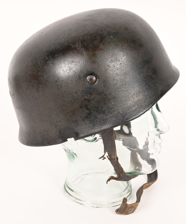 WWII LUFTWAFFE PARATROOPER HELMET BULLET STRUCK: Second pattern, early war, stamped sheet steel construction, paratrooper helmet retains a good portion of its original green/gray paint. To its side, a partial National Eagle holding a canted Swastika