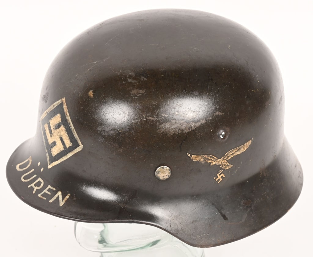 WW2 GERMAN LUFTWAFFE TRENCH ART HELMET Q68 WW2: The stamped, sheet steel construction helmet retains most of its original paint. The left side of the helmet has a second pattern, (Circa 1936/1937-1945), black detailed, silvery/white, Luftwaffe eagl