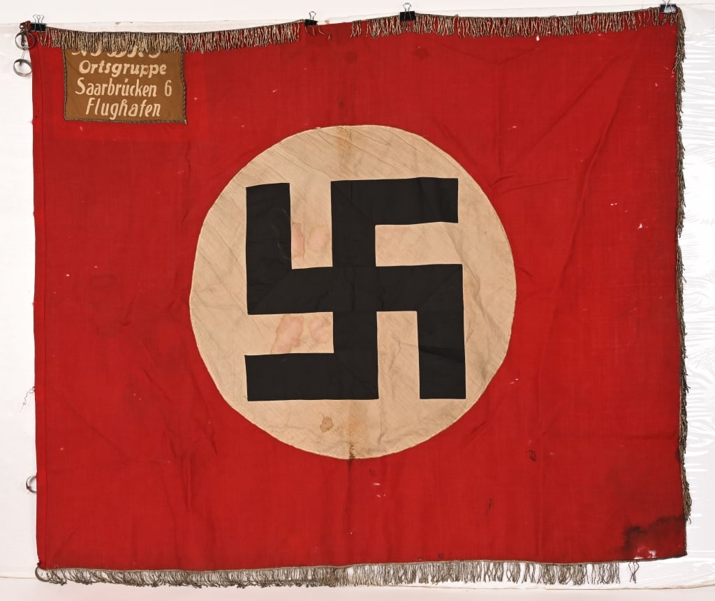 WWII NAZI GERMAN NSDAP ORTS FLAG SAARBRUCKEN WW2: WWII Nazi German flag is for the town of Saarbrücken 6 Flughafen which is the Airport in Saarbrücken. This Orts level flag measures 46 inches X 54 inches showing minimal wear into the