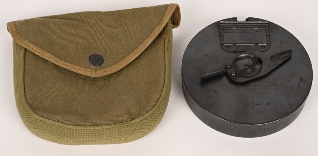 ORIGINAL THOMPSON SUB MACHINE GUN 50 RD DRUM MAG: Magazine type L, black finish, 50 rounds . Made by Auto Ordnance of West Hurley, New York USA. This is an original magazine made for the fully auto Thompson and comes with an original Drum Pouch . Nea