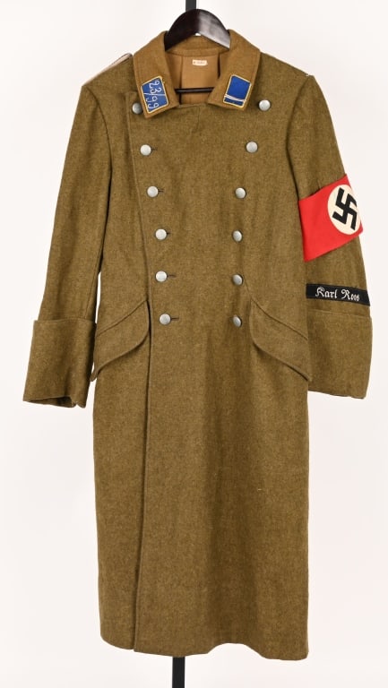 WWII NAZI GERMAN SA OVERCOAT W KARL ROOS CUFFTITLE: Attractive WWII Nazi German SA Overcoat from Gruppe Hessan or Hansa with original applied blue collar tabs with 23/99 and the rank side has a Sturmmann tab. The brown wool body is excellent having a K