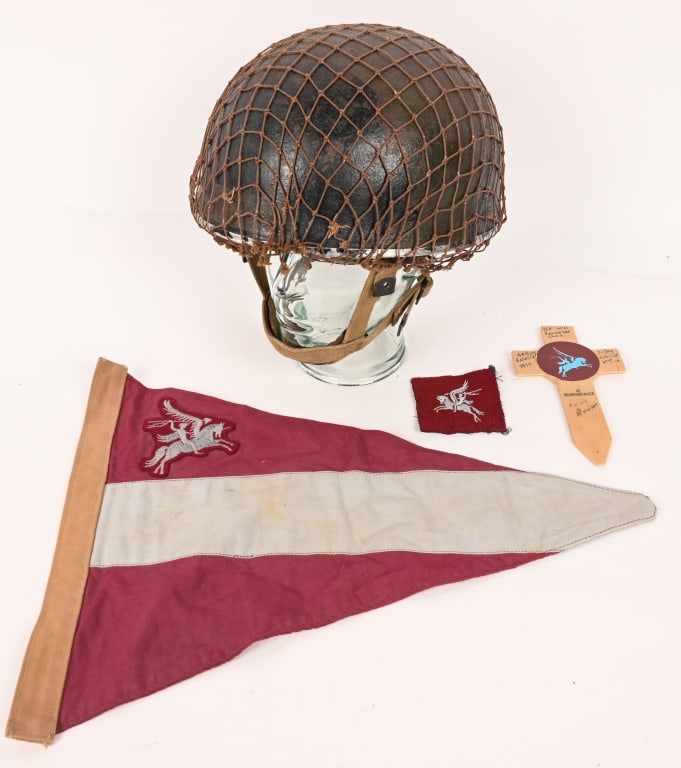 WWII BRITISH PARATROOPER LOT HELMET FLAG PATCH WW2: Lot of WWII British Paratrooper items to include 1) MKII PARATROOPER HELMET WITH CAMO PAINT. Similar in style to the German paratroopers’ helmet, the British Mk. II Paratroopers Helmet was origi