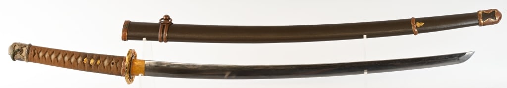 JAPANESE KATANA WITH SHIN GUNTO MOUNTS: 33 1/2" blade with 24 7/8" cutting edge. The blade is bright with a straight hamon and is excellent overall. The one hole tang is not signed. The katana has WW2 Shin Gunto mounts and pebble finish say