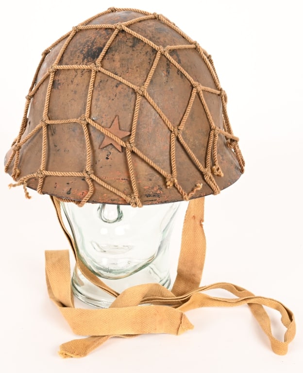 WWII IMPERIAL JAPANESE TYPE 90 COMBAT HELMET WW2: The standard WWII Japanese infantry combat helmet. The shell constructed from chrome molybend steel shows loads of period wear and combat use. The original IJA metal star affixed to the front that has