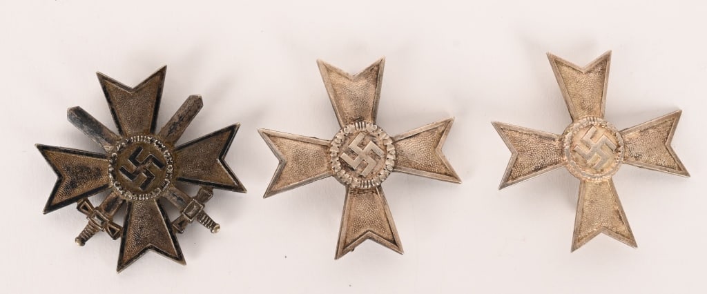 WWII NAZI GERMAN 1ST CLASS WAR MERIT CROSS LOT: Lot of three, WWII Nazi German War Merit Crosses to include 1) WAR MERIT CROSS 1ST CLASS, 1939 WITH SWORDS L/15. Die struck, zinc construction bravery award with a silver wash is in the form of a