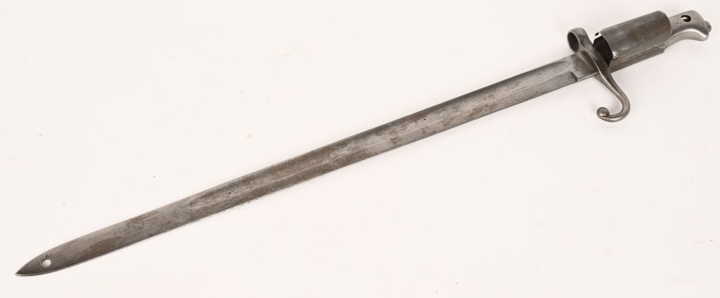 ITALIAN MODEL 1871 FLG POLE BAYONET: In very good general condition. No scabbard. Very good blade with a hole at the tip. Fine ricasso markings. Serial number on the cross guard. The release knob is not present. Unusual!