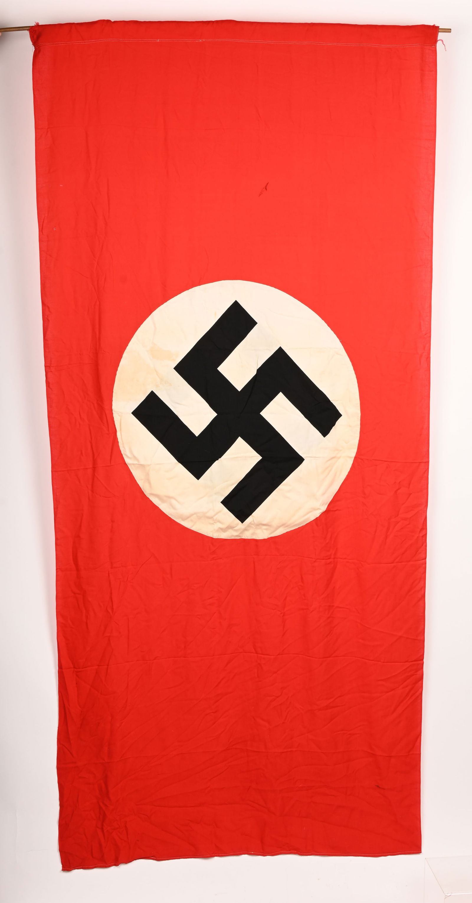 WWII NAZI GERMAN FLAG OR BANNER GI BRING BACK WW2: Roughly 88 x 41 inches, double sided cotton construction pennant. The pennant features a red base field with a central white circular disk with a printed canted black swastika to its center. Excellent