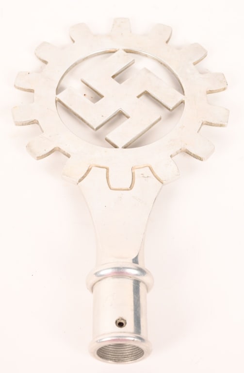 WWII NAZI GERMAN DAF FLAG POLE FINIAL WW2: DAF aluminum alloy construction flagpole final 10 inches in overall height which takes the form of the DAF emblem of a fourteen tooth cog wheel encompassing a canted swastika. RZM coded M3/34/35 indic