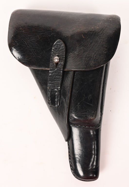 WWII P38 LEATHER HOLSTER W MAGAZINE BLA 1944 WW2: P38 Holster is a second pattern, molded, leather construction, P38 "soft shell" holster. The holster features a fold over top flap with a horizontal stitched hinge to the reverse and a stitched on ver