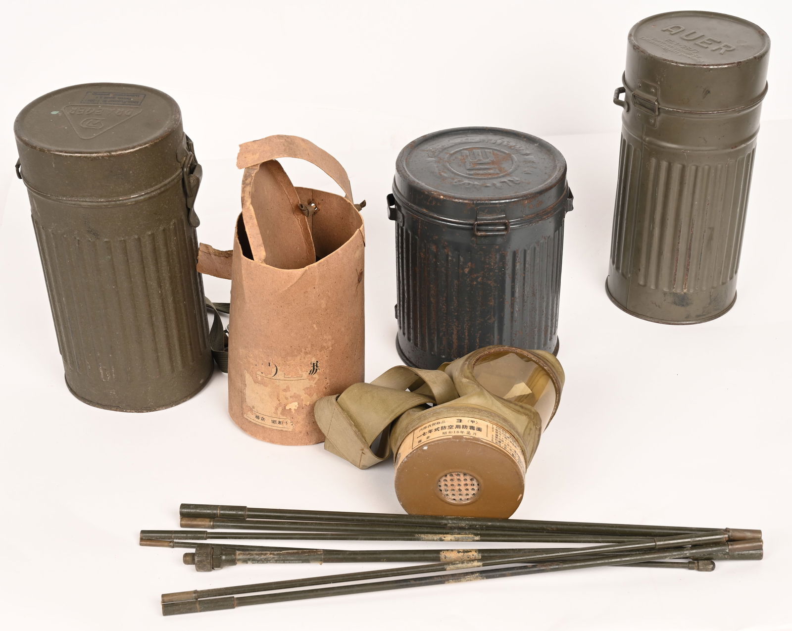 WWII NAZI GERMAN & JAPANESE GAS MASK LOT WW2: WWII Nazi German & Japanese Gas Mask lot to include 1) EARLY GAS MASK CANISTER. Early, variant pattern gasmask canister, with unique top lid closure. The corrugated, magnetic sheet metal canister is r