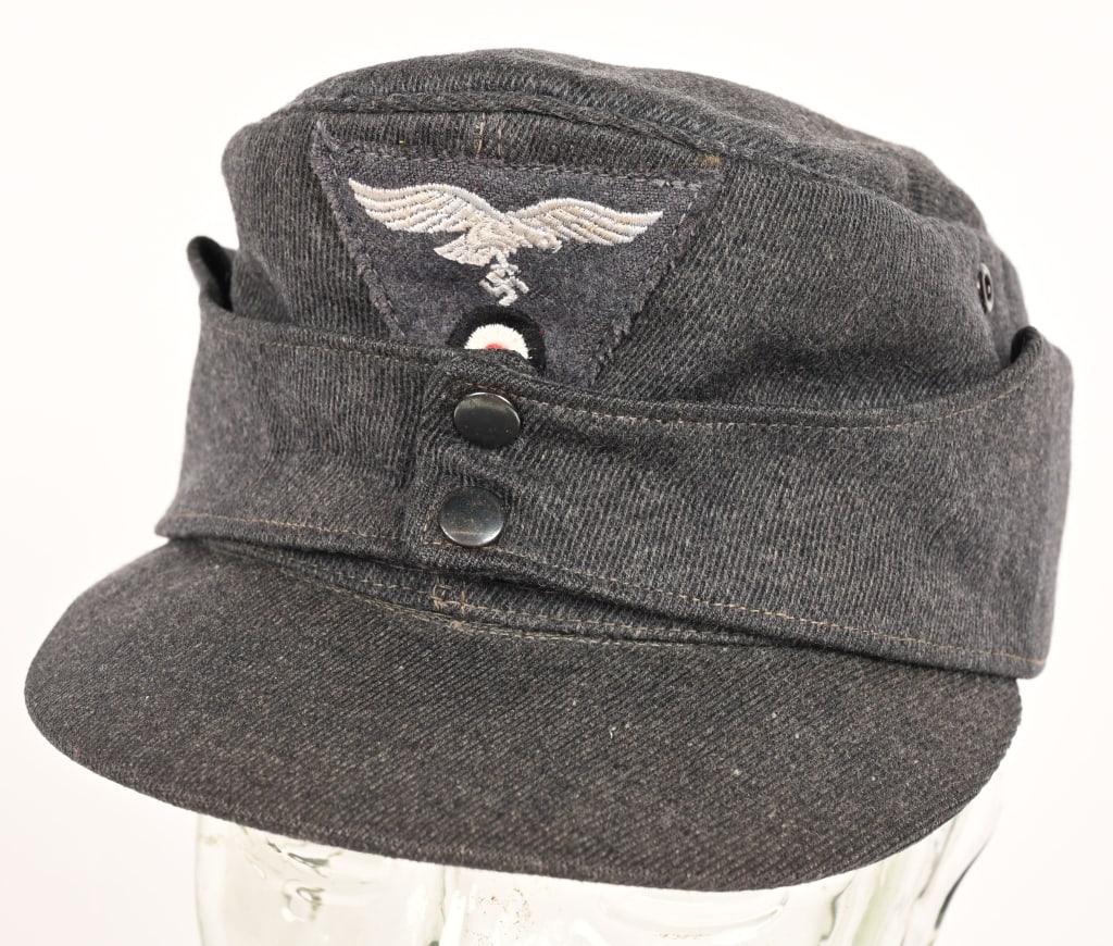 WWII NAZI GERMAN LUFTWAFFE M43 FIELD CAP OR HAT: Luftwaffe blue/gray, wool/rayon, blend material construction cap, with a subtle whipcord weave features fold down back and side panels with a downward scalloped front edge and forward sides, and two s