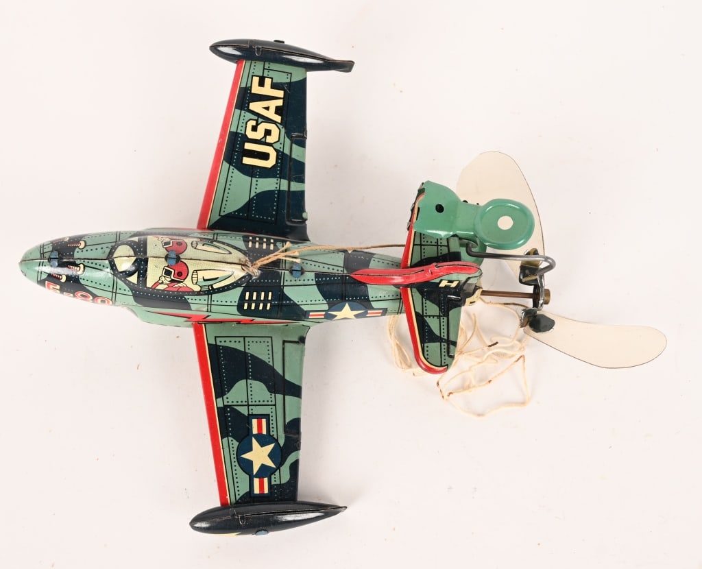 JAPAN TIN WINDUP USAF F-80 FLYING FIGHTER PLANE: All original and complete. very clean condition. Made to fly on string. Windup works. 7" Excellent