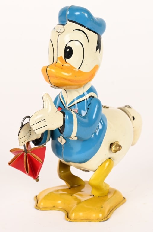 LINEMAR TIN WINDUP DONAD DUCK w/ UMBRELLA: All original and complete. Nice colors. Works. 5 1/2" Excellent Provenance: Don Hultzman Collection