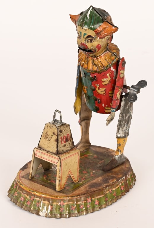 FISCHER TIN WINDUP WEIGHT LIFTING CLOWN: Wonderful German toy. All original and complete with weight. Windup works. Has some typical wear. 7" Very Good