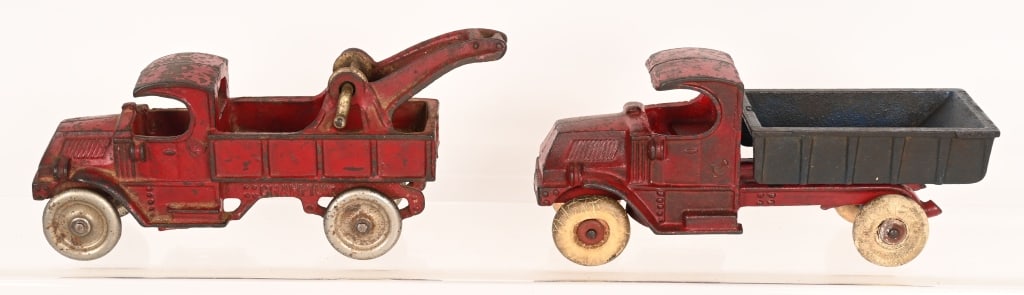 2- CHAMPION CAST IRON 8" MACK TRUCKS: Champion Mack dump truck and wrecker. All original with no cracks or breaks. 8" Very Good-Excellent
