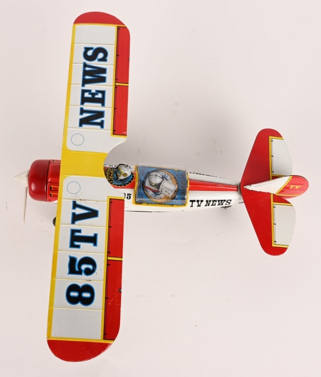 JAPAN TIN FRICTION TV NEWS AIRPLANE: All original in great shape. Has man with New Camera in plane. Friction works. One side of prop is off, but is included. 14 1/2" Excellent