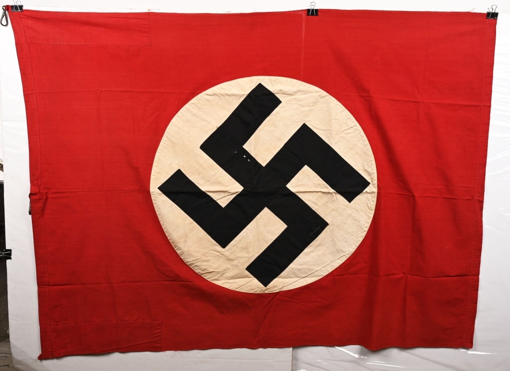 WWII NAZI GERMAN NSDAP FLAG DOUBLE SIDED WW2: Roughly 44 x 57 inches, double sided cotton construction pennant. The pennant features a red base field with a separately applied central white circular disk with a applied canted black swastika to it