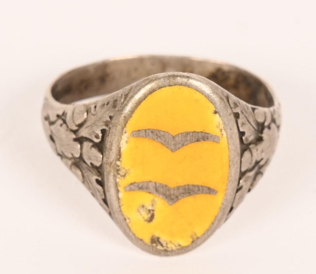 WWII NAZI GERMAN LUFTWAFFE FLIGHT ENLISTED RING: WWII Nazi German Luftwaffe Ring roughly a size 9. To the front a yellow enameled badge with two gulls indicating the rank of Gefreiter. Excellent.
