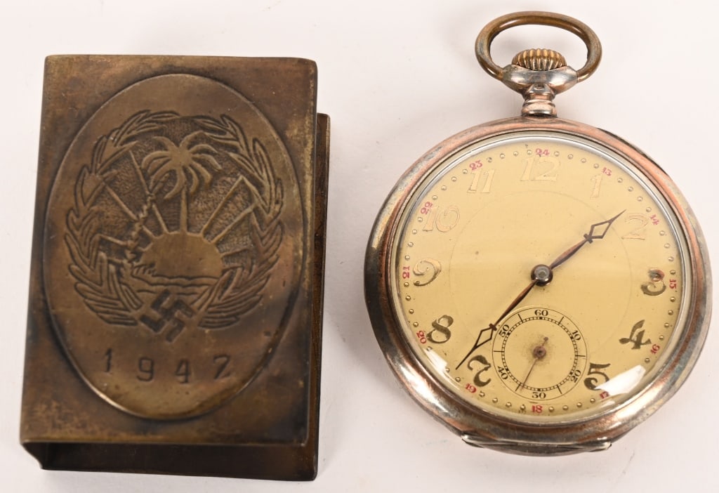 WWII NAZI GERMAN WATCH & MATCHSAFE AFRIKAKORPS WW2: WWII Nazi German engraved Afrikakorps pocket watch. This mens watch runs and keeps perfect time. To the reverse a National Eagle clutching a mobile Swastika with 4 palm trees with the monogram of the 