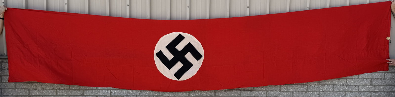 WWII NAZI GERMAN NSDAP FLAG OR BANNER WW2: Roughly 4 X 20 feet and is double sided, cotton construction banner or flag. The flag features a red base field with a separate central white circular disk with a applied canted black swastika to its 