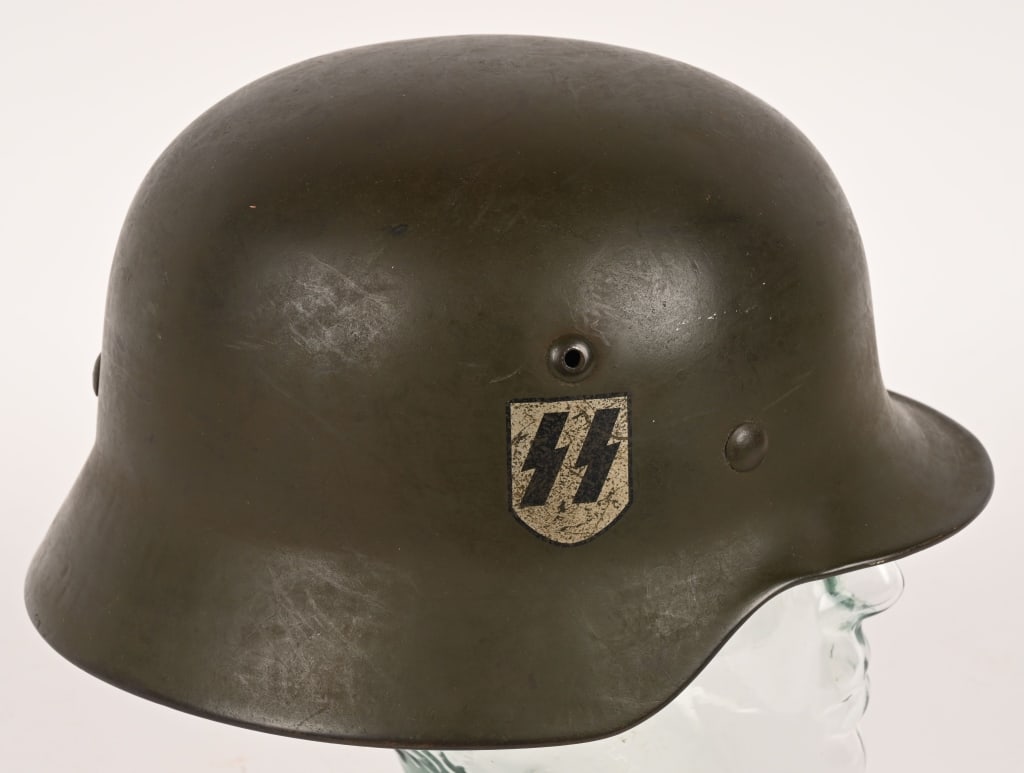 REPRO WWII WAFFEN SS M35 DD HELMET W LINER ET64: Reproduction Double Decal Waffen SS Helmet. Complete with M31 leather liner and is marked to the interior ET64 and was from lot number 1287